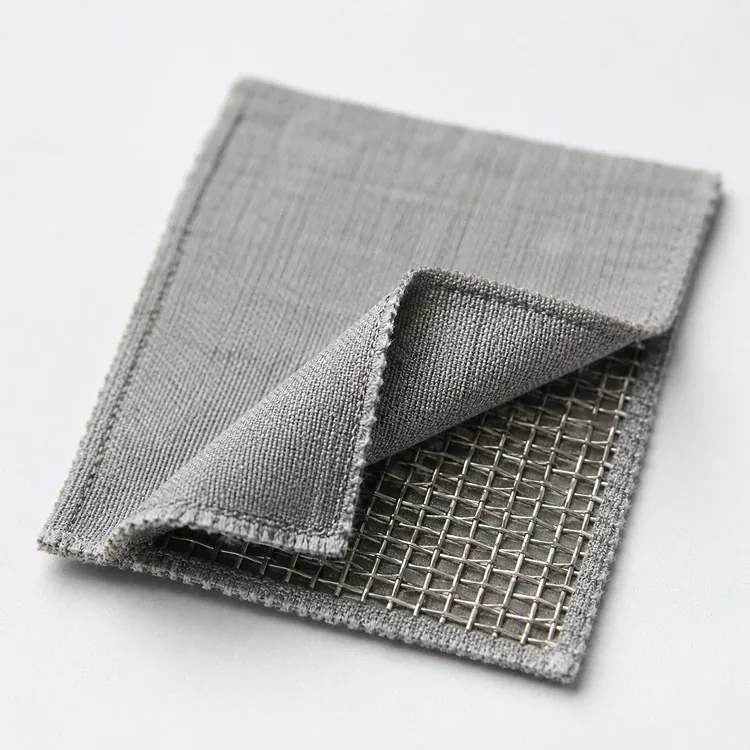Close-up of grounding sheet fabric folded back to reveal the stainless steel mesh