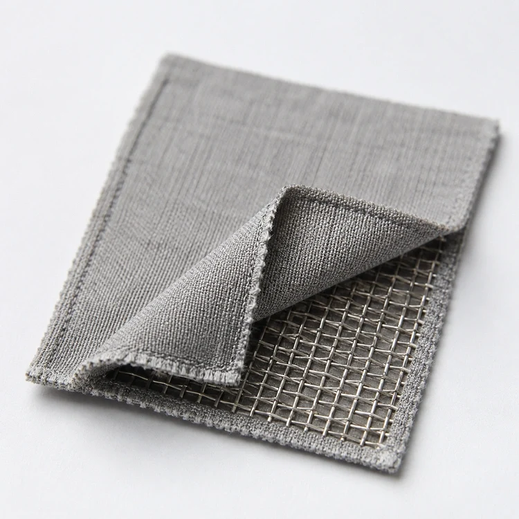 Close-up of grounding sheet fabric folded back to reveal the stainless steel conductive mesh woven into the core